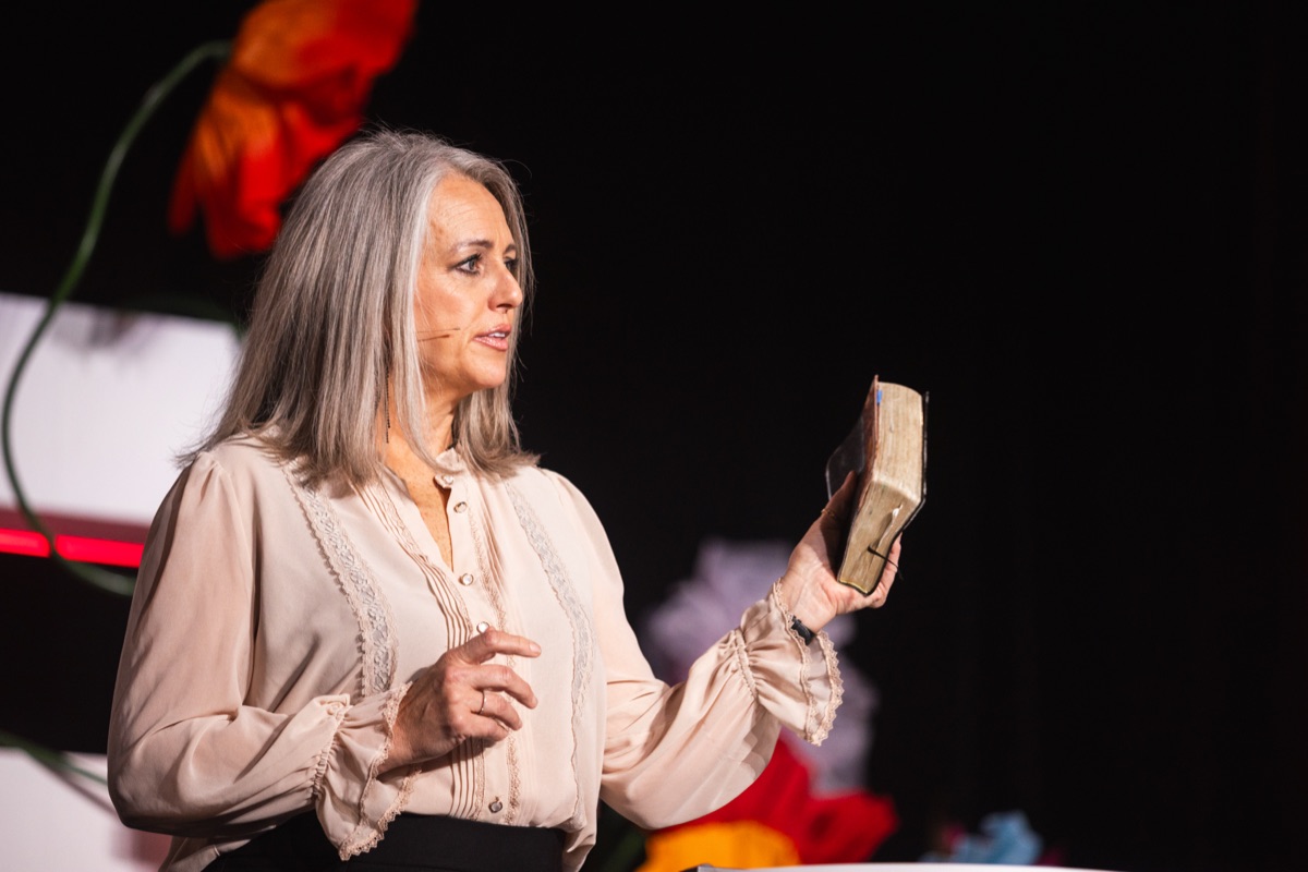 A speaker teaching from the Bible